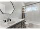 Bright bathroom with white marble and black fixtures at 1311 Fletcher Dr, Erie, CO 80516