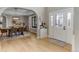Dining room open to entry, featuring a wood table, stylish chairs, and hardwood floors at 1311 Fletcher Dr, Erie, CO 80516