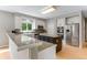 Updated kitchen featuring stainless steel appliances and a center island with seating at 1311 Fletcher Dr, Erie, CO 80516