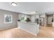 Bright kitchen with a breakfast bar, stainless steel appliances, and hardwood floors at 1311 Fletcher Dr, Erie, CO 80516