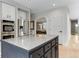 Stylish kitchen featuring stainless steel appliances and a granite countertop island at 1311 Fletcher Dr, Erie, CO 80516