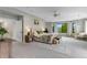 Bright main bedroom boasting large windows and scenic views with a cozy sitting area at 1311 Fletcher Dr, Erie, CO 80516
