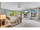 Spacious main bedroom featuring a fireplace and bay windows with scenic outdoor views at 1311 Fletcher Dr, Erie, CO 80516