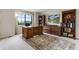 Spacious office with rich wood furniture, mountain view, and ample storage space, perfect for productivity at 1311 Fletcher Dr, Erie, CO 80516