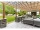 Back patio featuring an outdoor kitchen, a built-in grill, and a dining area under a charming pergola at 1311 Fletcher Dr, Erie, CO 80516