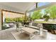Spacious outdoor patio with comfortable seating, a pergola, and a beautifully landscaped backyard for entertaining at 1311 Fletcher Dr, Erie, CO 80516