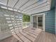 Back deck with pergola, latticework, and sliding glass door at 31 Shetland Ct, Highlands Ranch, CO 80130