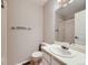 Clean and functional bathroom featuring a tiled shower, simple vanity, and essential fixtures at 31 Shetland Ct, Highlands Ranch, CO 80130