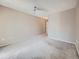 Simple bedroom with neutral walls, carpeted floors, and a ceiling fan, offering a blank canvas at 31 Shetland Ct, Highlands Ranch, CO 80130