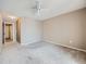 Empty bedroom featuring neutral walls, ceiling fan, and carpeted floors, ready for personalization at 31 Shetland Ct, Highlands Ranch, CO 80130