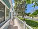 Outdoor deck with white railings, offering peaceful views of the street and neighborhood at 31 Shetland Ct, Highlands Ranch, CO 80130