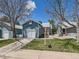 Inviting front yard with a well-kept lawn and driveway leading to an attached garage at 31 Shetland Ct, Highlands Ranch, CO 80130