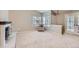 Spacious living room features neutral colors, comfortable seating, and lots of natural light at 31 Shetland Ct, Highlands Ranch, CO 80130