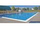 Beautiful community pool with clear blue water and ample seating areas at 31 Shetland Ct, Highlands Ranch, CO 80130