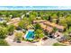 An aerial view featuring a community pool and surrounding homes, showcasing the neighborhood's amenities at 14076 E Radcliff Cir, Aurora, CO 80015