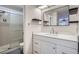 Clean and modern bathroom featuring a glass-enclosed shower and a stylish vanity at 14076 E Radcliff Cir, Aurora, CO 80015