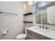 A modern bathroom featuring a stylish vanity, an enclosed shower, and a sleek mirror at 14076 E Radcliff Cir, Aurora, CO 80015