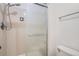 Bathroom featuring a glass-enclosed shower and a toilet at 14076 E Radcliff Cir, Aurora, CO 80015