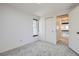 This bedroom features plush carpet, neutral walls, a closet, and a window at 14076 E Radcliff Cir, Aurora, CO 80015