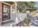 Inviting front porch with address display, leading to the main entrance with secure screen door at 14076 E Radcliff Cir, Aurora, CO 80015