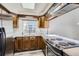 Efficient kitchen featuring stainless steel appliances, a skylight, and bright countertops at 14076 E Radcliff Cir, Aurora, CO 80015