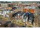 A neighborhood aerial view of modern townhouses with balconies and urban landscape at 2451 Lawrence St # 2, Denver, CO 80205