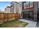 Private backyard with patio and green space, perfect for outdoor entertaining and relaxation at 2451 Lawrence St # 2, Denver, CO 80205