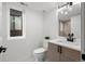 Bright bathroom featuring a modern vanity with a sleek countertop and a stylish black faucet at 2451 Lawrence St # 2, Denver, CO 80205