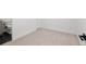 Bright bedroom adjacent to bathroom featuring plush carpet flooring at 2451 Lawrence St # 2, Denver, CO 80205