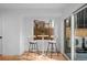 Cozy breakfast nook with modern table, chairs, and a sliding glass door for natural light at 2451 Lawrence St # 2, Denver, CO 80205