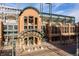 Exterior view of Coors Field main entrance on a sunny day with a clear blue sky at 2451 Lawrence St # 2, Denver, CO 80205