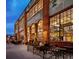 Denver Central Market offers a vibrant scene with outdoor seating and large windows showcasing the lively interior at 2451 Lawrence St # 2, Denver, CO 80205