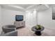 A well-lit living room featuring modern furniture and stylish accents, ideal for comfortable living at 2451 Lawrence St # 2, Denver, CO 80205