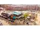 Aerial view of a lively rooftop patio with dining and lounging areas in a urban setting at 2451 Lawrence St # 2, Denver, CO 80205