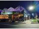 Exterior nighttime view of Uchi Denver restaurant with modern architecture and outdoor seating at 2451 Lawrence St # 2, Denver, CO 80205