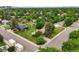 Charming home with a lush green yard surrounded by mature trees, perfect for outdoor enjoyment at 8198 E Lehigh Dr, Denver, CO 80237