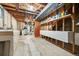 Unfinished basement with storage shelves, utility sink, and laundry hookups at 8198 E Lehigh Dr, Denver, CO 80237