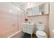 Classic bathroom with a tub, shower, vanity, and a clean, bright atmosphere at 8198 E Lehigh Dr, Denver, CO 80237