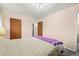 Bedroom featuring neutral decor, wooden doors, and a relaxing atmosphere at 8198 E Lehigh Dr, Denver, CO 80237