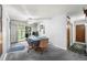 Inviting dining area with neutral carpeting and sliding glass doors to the outside at 8198 E Lehigh Dr, Denver, CO 80237