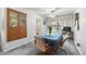 Comfortable dining room with neutral carpeting, ceiling fan, and sliding glass doors to the backyard at 8198 E Lehigh Dr, Denver, CO 80237