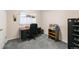 Home office setup with a desk, chair, and storage, providing a functional workspace at 8198 E Lehigh Dr, Denver, CO 80237