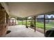 Covered brick patio overlooking the fenced backyard and garden shed at 8198 E Lehigh Dr, Denver, CO 80237