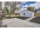Large backyard with a detached garage and a concrete patio at 4874 S Lincoln St, Englewood, CO 80113