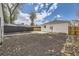 Grassy backyard featuring wooden fences and newly landscaped areas at 4874 S Lincoln St, Englewood, CO 80113