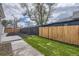 Backyard featuring wooden fences and a newly landscaped section at 4874 S Lincoln St, Englewood, CO 80113