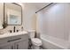 Bathroom showing modern vanity, new tilework, shower and tub at 4874 S Lincoln St, Englewood, CO 80113