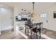 Charming dining area features a dining table and an adjacent, open-concept kitchen at 4874 S Lincoln St, Englewood, CO 80113