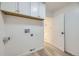 Clean laundry room featuring overhead cabinets and washer/dryer hookups at 4874 S Lincoln St, Englewood, CO 80113