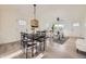 Inviting living area features a dining table and an adjacent living room area with hardwood floors at 4874 S Lincoln St, Englewood, CO 80113